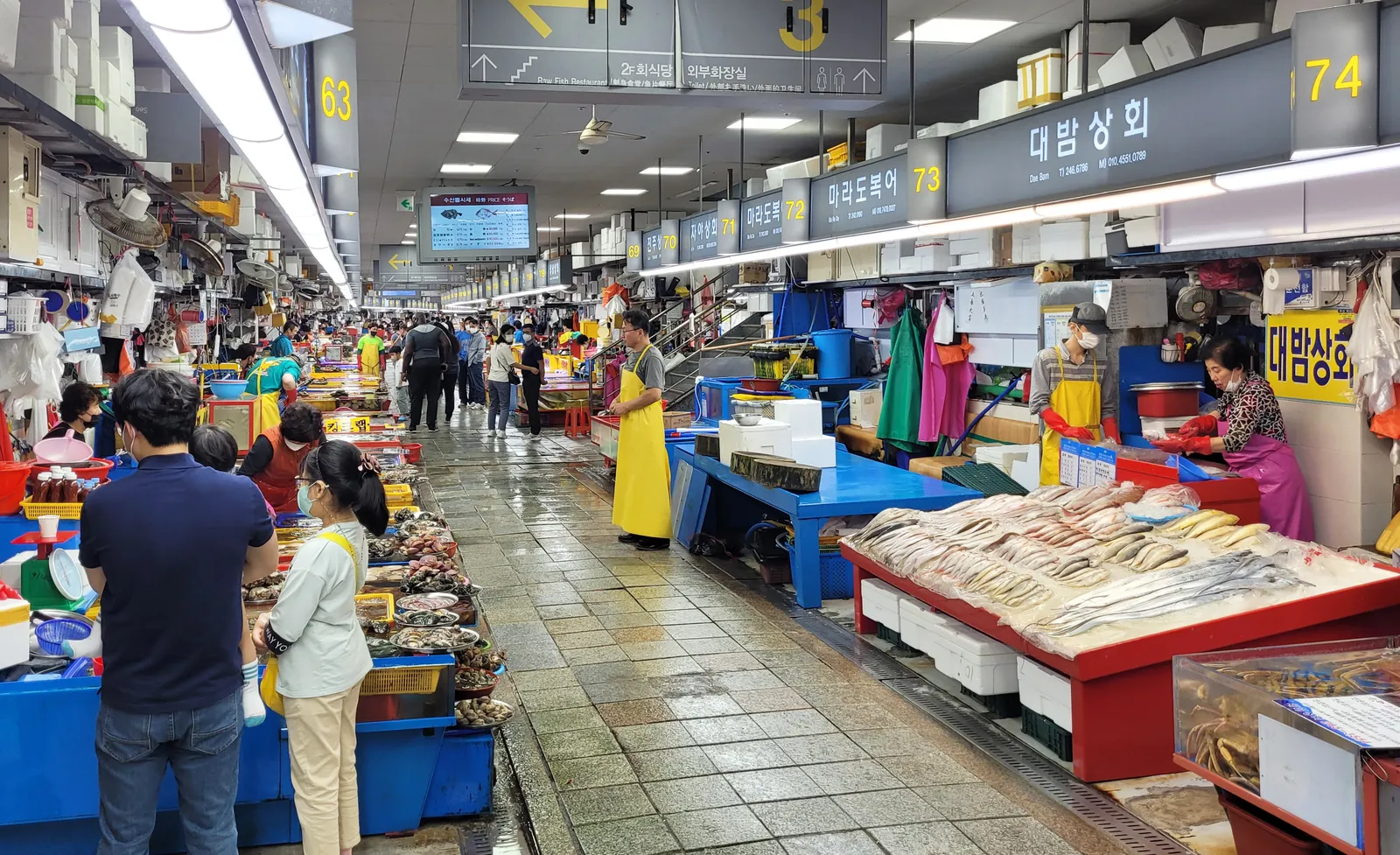 Long aisle of seafood stalls inside Jagalchi fish market in Busan